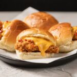 Cheesy Dynamite Chicken Buns Crispy and Spicy – A Comfort-Food Favorite With a Fiery Kick